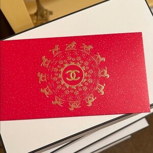 CHANEL Red Card with Gold Zodiac Design